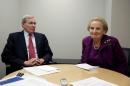 Former National Security Advisor Stephen Hadley and former U.S. Secretary of State Madeleine Albright prepare for an interview in Washington.