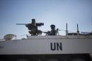 In this file photo taken Thursday, Aug. 28, 2014, an armored vehicle with the U.N. peacekeepers of the United Nations Disengagement Observer Force, also known as UNDOF, waits to cross from the Israeli-controlled Golan Heights to Syria.