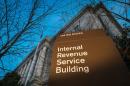 This photo taken April 13, 2014 shows the headquarters of the Internal Revenue Service (IRS) in Washington at daybreak. Tuesday, April 15, is the federal tax filing deadline for most Americans. (AP Photo/J. David Ake)
