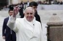 Pope Francis waves as he conducts his weekly general audience at St. Peter's Square at the Vatican