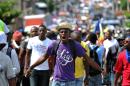 Supporters of LAPEH, Fanmi Lavalas and Pitit Dessalines parties march in the street in Port-au-Prince, on November 11, 2015, protesting against the Haiti election results