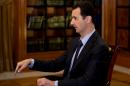 In this photo, which AP obtained from Syrian official news agency SANA and which has been authenticated based on its contents and other AP reporting, President Bashar Assad gestures as he speaks during an interview with Lebanon's Al-Mayadeen TV, at the presidential palace in Damascus, Syria, Monday, Oct. 21, 2013. Syria's president said Monday that the factors that would allow a landmark conference aimed at ending the country's civil war do not yet exist, throwing further doubt on international efforts to hold peace talks that have already been repeatedly delayed. (AP Photo/SANA)