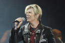 FILE - In this Dec. 15, 2003 file photo, singer/songwriter David Bowie launches his United States leg of his worldwide tour called "A Reality Tour," at Madison Square Garden in New York. A brief "60 Minutes" piece on the late David Bowie that aired Sunday, Jan. 24, 2016, was the result of a 15-year journey of missed connections involving three of the newsmagazine's correspondents and a rock star gone underground. Bowie talked about his artistry and getting old in interview clips from 2003 that were never aired before Sunday on "60 Minutes." Bowie died Sunday, Jan. 10, after battling cancer for 18 months. He was 69. (AP Photo/Kathy Willens, File)