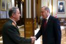 Turkey President Recep Tayyip Erdogan, right, shakes hands with the Chief of general staff General Hulusi Akar during a meeting with the top-level military meeting at the Presidential palace in Ankara, Turkey, on Friday, July 29, 2016. Erdogan met with Hulusi Akar, the four-star general who retained his position as chief of staff following a Supreme Military Council meeting, as well as other top military brass of the Turkish armed forces. (Kayhan Ozer/Presidential Press Service, Pool Photo via AP)