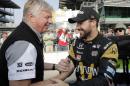 James Hinchcliffe, right, of Canada, celebrates with a crew member after he qualified on the opening day of qualifications for the Indianapolis 500 auto race at Indianapolis Motor Speedway in Indianapolis, Saturday, May 21, 2016. (AP Photo/Darron Cummings)