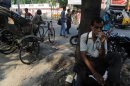 An Indian drinks tea at roadside shop in Siliguri