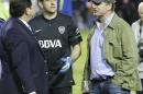 In this May 14, 2015 photo, Conmebol delegate Roger Bello of Bolivia, left, talks with Boca Juniors goalkeeper Agustin Orion, center, and Alejandro Burzaco, right, president of Torneos y Competencias, moments before canceling the Copa Libertadores soccer match between Boca Juniors and River Plate in Buenos Aires, Argentina. A US Justice Department indictment was announced Wednesday, May 27, 2015, against nine FIFA officials and several corporate executives for racketeering, conspiracy and corruption. Burzaco is one of the sports marketing executives charged. (AP Photo/Victor R. Caivano)