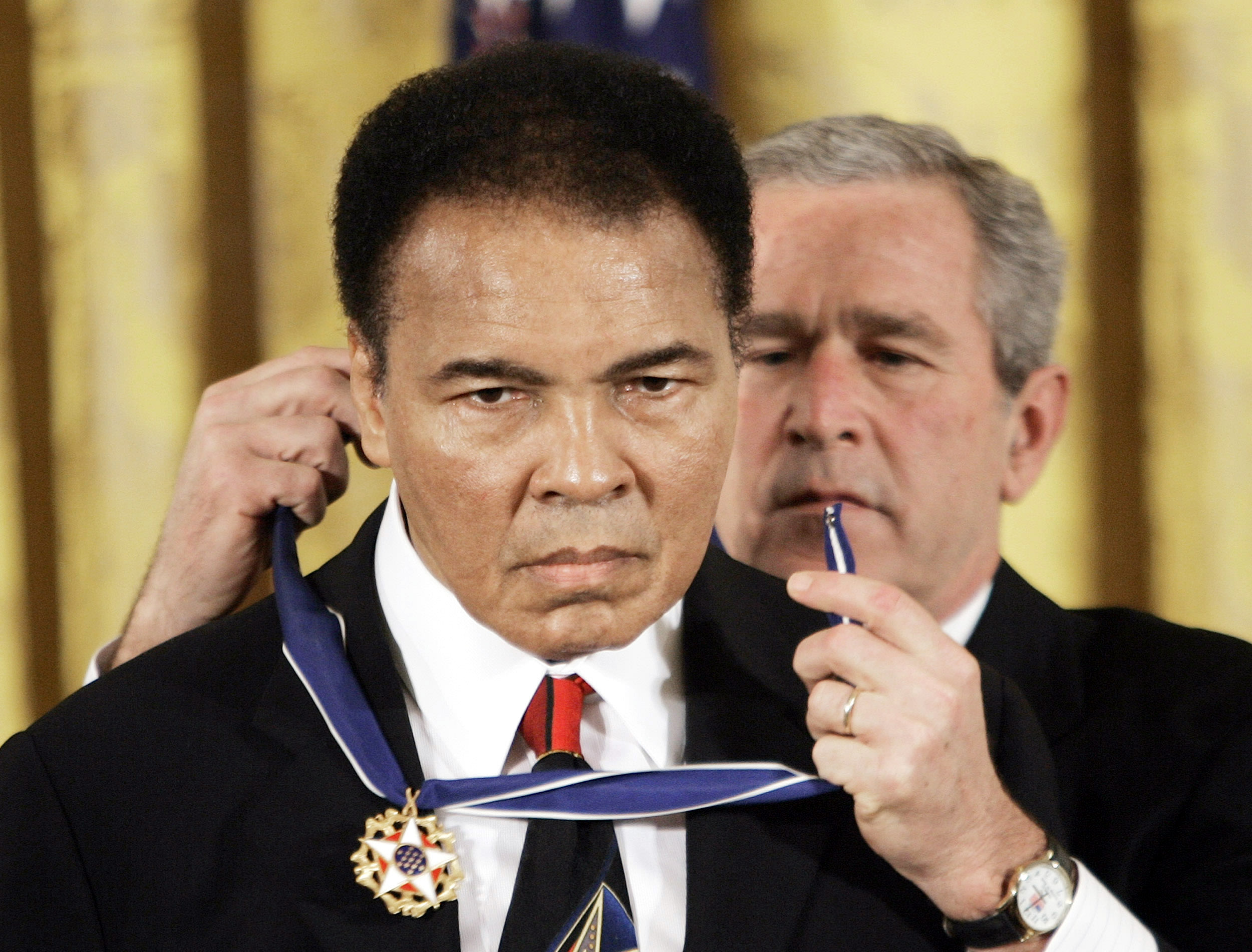 President Bush presents the Presidential Medal of Freedom to Muhammad Ali in 2005. (AP)
