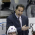 FILE - In this April 5, 2013 file photo, New York Rangers head coach John Tortorella stands behind his bench during an NHL hockey game against the Pittsburgh Penguins in Pittsburgh. The Rangers have fired coach Tortorella, Wednesday, May 29, 2013, four days after New York was eliminated from the Stanley Cup playoffs. (AP Photo/Gene J. Puskar, File)
