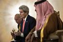 Saudi Minister of Foreign Affairs Prince Saud al-Faisal listens as U.S. Secretary of State Kerry makes a statement to the press at King Khalid International Airport in Riyadh