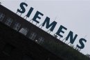 The logo of Siemens AG is seen atop a factory in Berlin