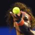 Serena Williams of the U.S. serves to Maria Kirilenko of Russia during their women's singles match at the Australian Open tennis tournament in Melbourne