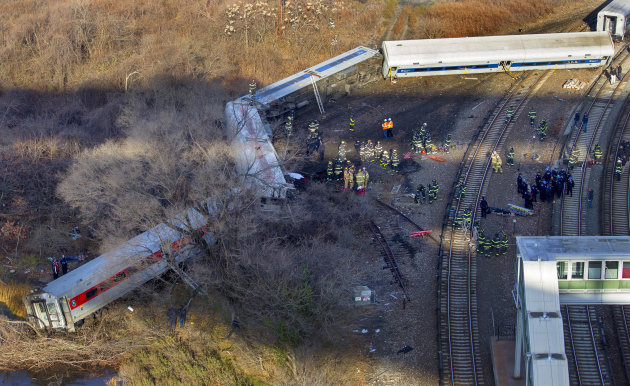 First responders gather at the derailment of a Metro North passenger train in the Bronx borough of New York Sunday, Dec. 1, 2013 The Fire Department of New York says there are "multiple injuries" in the train derailment, and 130 firefighters are on the scene. Metropolitan Transportation Authority police say the train derailed near the Spuyten Duyvil station. (AP Photo/Craig Ruttle)