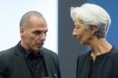 Greek Finance Minister Yanis Varoufakis (L) speaks with International Monetary Fund Managing Director Christine Lagarde prior to a eurozone finance ministers meeting in Luxembourg on June 18, 2015