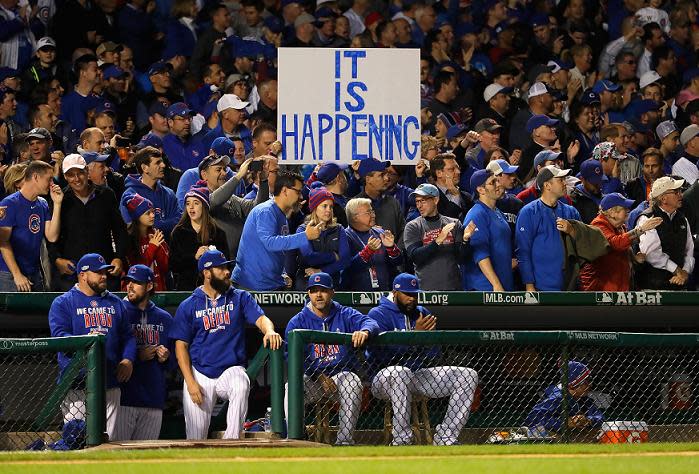 Fans hold up a sign during game six of the National League Championship Series at Wrigley Field. (Getty Images)