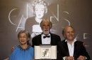 Director Haneke poses with actors Riva and Trintignant during a photocall after receiving the Palme d'Or award for the film Amour at the 65th Cannes Film Festival