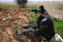 Rebel fighters take part in a training session in the northeastern city of Deir Ezzor, on March 25, 2014