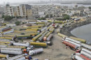 Oil tankers, which were used to transport NATO fuel supplies to Afghanistan, are parked in a compound in Karachi, Pakistan, Friday, May 25, 2012. Pakistan's parliament has unanimously approved new guidelines for the country in its troubled relationship with the United States, a decision that could pave the way for the reopening of supply lines to NATO troops in neighboring Afghanistan. (AP Photo/Fareed Khan)