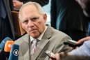 Germany's Finance Minister Wolfgang Schauble talks with journalists as he arrives for a Eurogroup meeting in Luxembourg, Thursday, June 20, 2013. (AP Photo/Geert Vanden Wijngaert)