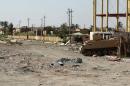 A picture taken on June 21, 2014 in the city of Ramadi shows a tank left in a street