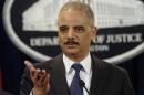 Attorney General Eric Holder announces a $1.2 billion settlement with Toyota over its disclosure of safety problems, Wednesday, March 19, 2014, during a news conference at the Justice Department in Washington. (AP Photo/Susan Walsh)