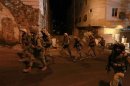 Israeli soldiers patrol in the West Bank city of Hebron