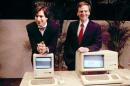 FILE -This January 1984, file photo, shows Steven P. Jobs, left and John Sculley presenting the new Macintosh Desktop Computer in January 1984 at a shareholder meeting in Cupertino, Calif. January 24, 2014, marks thirty years after the first Mac computer was introduced, sparking a revolution in computing and in publishing as people began creating fancy newsletters, brochures and other publications from their desktops. (AP Photo/FILE)