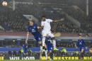Everton's Philip Jagielka, left, fights for the ball against Dynamo Kiev's Dieumerci Mbokani during the Europa League round of 16 first leg soccer match between Everton and Dynamo Kiev at Goodison Park Stadium, Liverpool, England, Thursday March 12, 2015. (AP Photo/Jon Super)