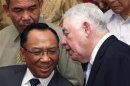 Freeport McMoran Chief Executive Richard Adkerson chats with Indonesian Minister of Energy and Mineral Resources Jero Wacik during a news conference after their meeting in Jakarta