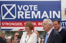 British Prime Minister David Cameron (R) stands with Labour's Harriet Harman (L) as former Conservative Prime Minister John Major addresses pro-EU "Vote Remain" supporters during a rally in Bristol, south-west England, on June 22, 2016