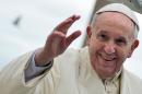 Pope Francis waves to pilgrims gathered at Saint Peter's square in the Vatican, on February 5, 2014