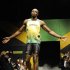 Jamaican sprinter Usain Bolt models the Jamaican team's kit for the London 2012 Olympic Games, in London