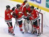 Blackhawks Hossa, Toews, and Oduya celebrate with goalie Emery after their NHL hockey game against the San Jose Sharks in Chicago
