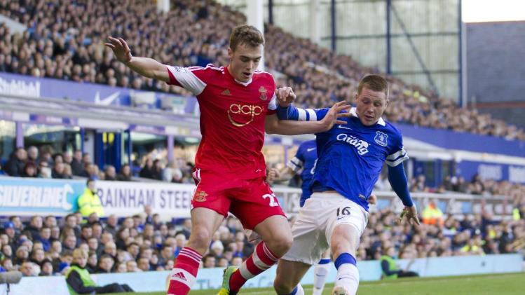 FILE - This is a Sunday Dec. 29, 2013 file photo of Southampton&#39;s Calum Chambers as he fights for the ball against Everton&#39;s James McCarthy,during their English Premier League soccer match at Goodison Park Stadium, Liverpool, England. English Premier League team Arsenal has signed defender Calum Chambers from Southampton for an undisclosed fee . The 19-year-old Chambers has penned a “long-term” contract at Arsenal, according to the North London club on Monday July 28, 2014. (AP Photo/Jon Super, File)