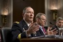 Gen. Keith B. Alexander, director of the National Security Agency and head of the U.S. Cyber Command, answers questions from lawmakers on Capitol Hill in Washington, Wednesday, June 12, 2013, during a Senate Appropriations Committee hearing. It is his first public appearance before Congress since revelations that the electronic surveillance agency is sweeping up Americans' phone and Internet records in its quest to investigate terrorist threats. Left to right are Gen. Keith B. Alexander, director of the National Security Agency, Rand Beers, under secretary for the Department of Homeland Security, and Patrick Gallagher, director of the Commerce Department's National Institute of Standards and Technology. (AP Photo/J. Scott Applewhite)