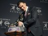 Texas A&M quarterback Johnny Manziel poses with the Heisman Trophy after becoming the first freshman to win the award, Saturday, Dec. 8, 2012, in New York. (AP Photo/Henny Ray Abrams)