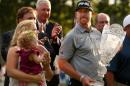 Hunter Mahan celebrates with his wife Kandi, daughter Zoe and the tournament trophy after winning of The Barclays at The Ridgewood Country Club on August 24, 2014 in Paramus, New Jersey