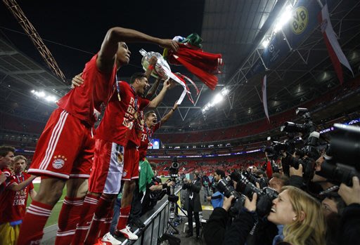 Bayern Munich players react, after winning the Champions League Final soccer match against Borussia Dortmund, at Wembley Stadium in London, Saturday May 25, 2013