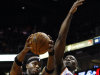 Phoenix Suns' Jermaine O'Neal (20) grabs a rebound in front of Oklahoma City Thunder's Kendrick Perkins (5) during the first half in an NBA basketball game Sunday, Feb. 10, 2013, in Phoenix.(AP Photo/Ross D. Franklin)