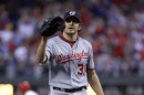 Washington Nationals' starting pitcher John Lannan waits for a new ball after Philadelphia Phillies' Shane Victorino hit a two-run home run in the third inning of a baseball game on Thursday, May 5, 2011, in Philadelphia. (AP Photo/H. Rumph Jr)