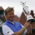 Ernie Els of South Africa holds up the Claret Jug after winning at the British Open golf championship at Royal Lytham & St Anne