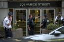 Police investigate the scene of a shooting at a federal office building in Lower Manhattan, New York