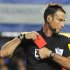 Referee Mark Clattenburg holds a red card after sending off Chelsea's Branislav Ivanovic during their English Premier League soccer match against Manchester United at Stamford Bridge in London