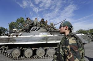 A pro-Russian rebel watches as Ukrainian troops evacuated &hellip;