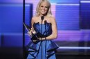 Carrie Underwood accepts the award for favorite country album at the 40th American Music Awards in Los Angeles