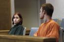 FILE - In this Oct. 11, 2011 file photo, Holly Grigsby, left, looks at her boyfriend, David "Joey" Pedersen, during an appearance in Yuba County Superior Court in Marysville, Calif. On Tuesday, July 15, 2014, a federal judge in Portland, Ore. sentenced Grigsby to life in prison for her role in a Pacific Northwest killing spree that authorities say was part of a white supremacist scheme. Pedersen is scheduled to be sentenced in August 2014. (AP Photo/Rich Pedroncelli, File)