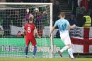 England goalkeeper Joe Hart, second left, makes a save during the World Cup Group F qualifying soccer match between Slovenia and England, at Stozice stadium in Ljubljana, Slovenia, Tuesday, Oct. 11, 2016. (AP Photo/Darko Bandic)
