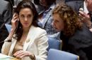 U.N. Special Envoy for Refugees and Hollywood star Angelina Jolie, left, confers, during her appearance before the U.N. Security Council on Syria's refugee crisis, Friday, April 24, 2015. (AP Photo/Bebeto Matthews)