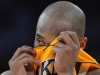 Los Angeles Lakers guard Kobe Bryant wipes his face during the second half in Game 4 of an NBA basketball playoffs Western Conference semifinal against the Oklahoma City Thunder, Saturday, May 19, 2012, in Los Angeles. The Thunder won 103-100. (AP Photo/Mark J. Terrill)
