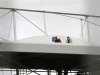 Men work on the roof of the Fonte Nova stadium after heavy rain in preparation for the 2013 Confederations Cup, in Salvador